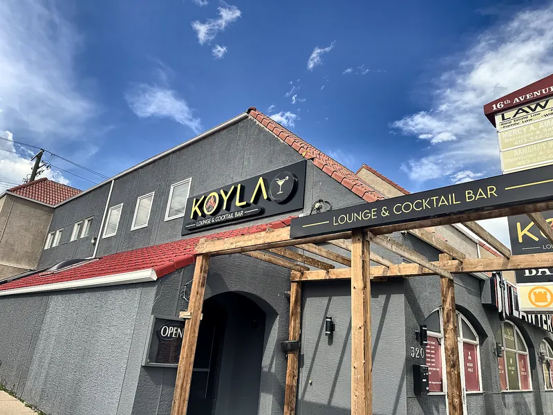 Koyla's building on 16 Ave NW on a sunny day