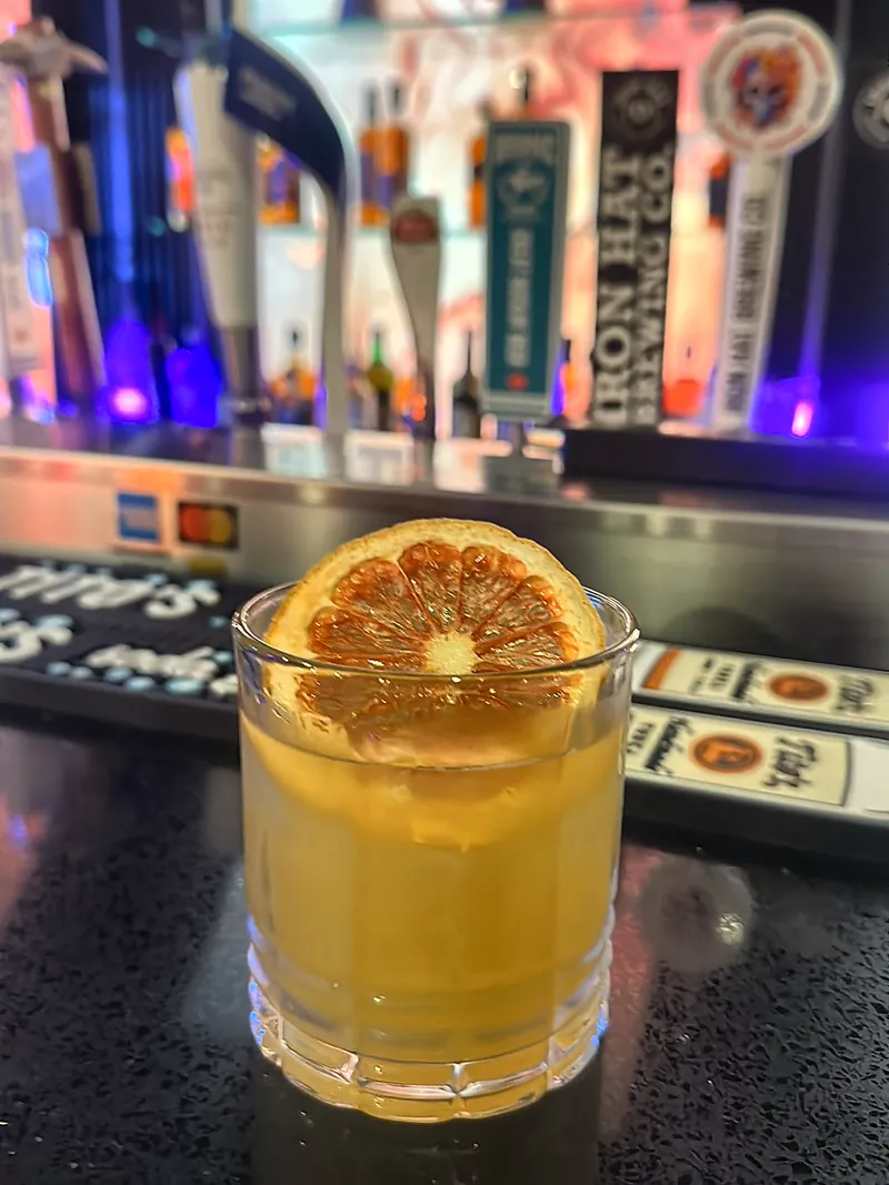 A citrus cocktail on the bar